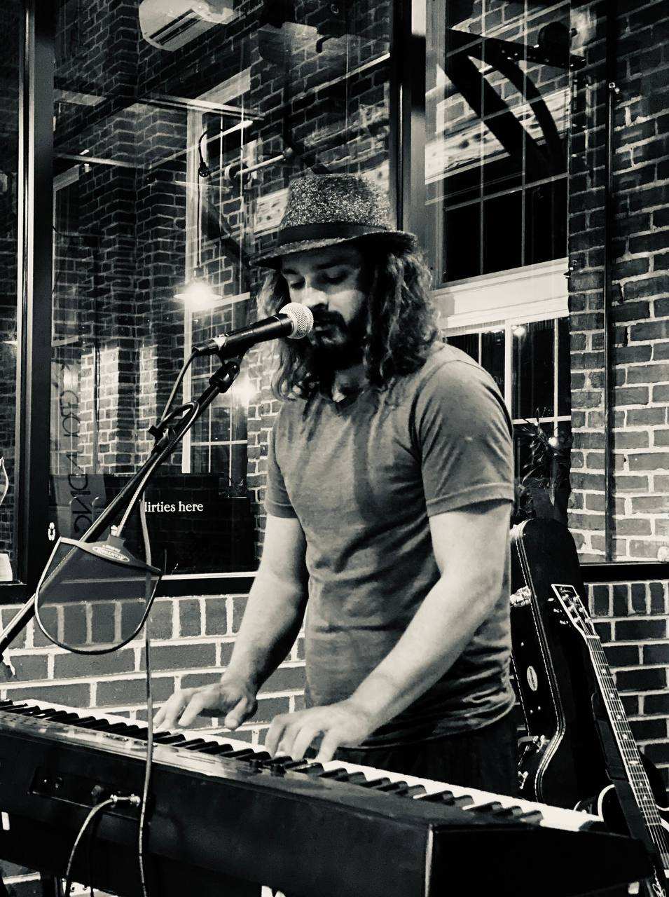 Joe Greco performing on keys and vocals