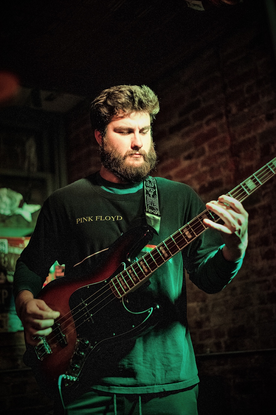 Nick Davis performing on bass with The Goons